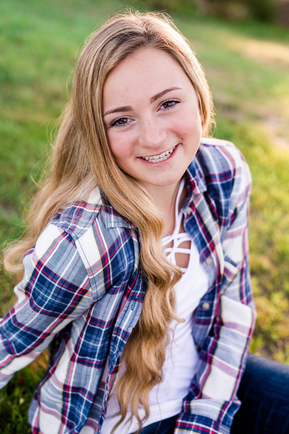 Country Styled High School Senior Pictures on a Farm and Little Cormorant Lake in Minnesota by Amber Langerud with Grass Background