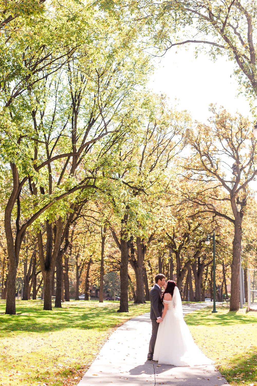 Downtown Fargo Disney Themed Wedding by Amber Langerud Photography | Bride & Groom Island Park