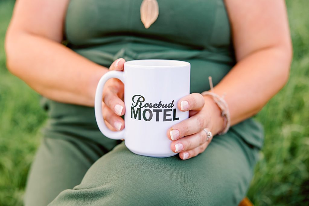 Woman Holding Mug Wearing Green Romper | Amber Langerud Photography