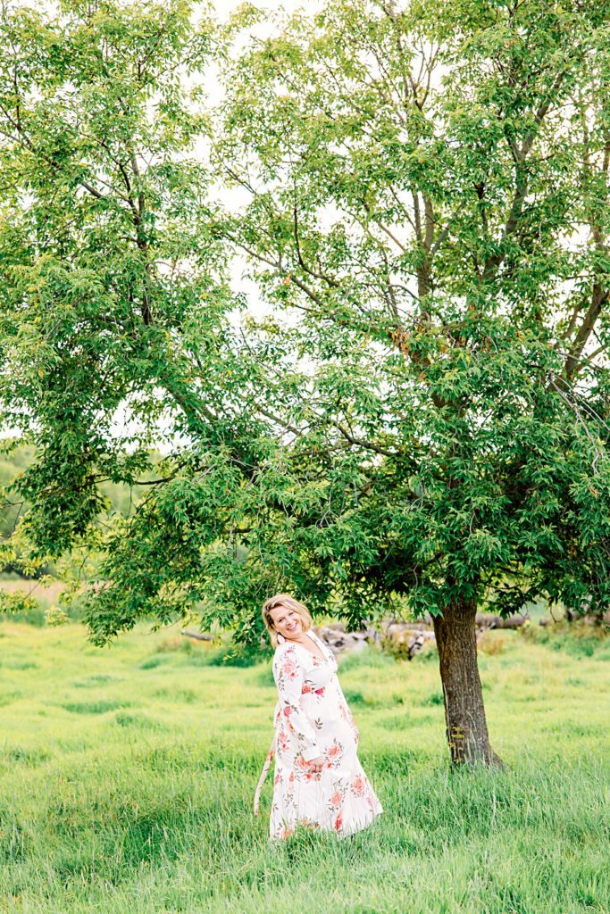 Wedding Photographer Twirling in Floral Dress Headshot | Amber Langerud Photography