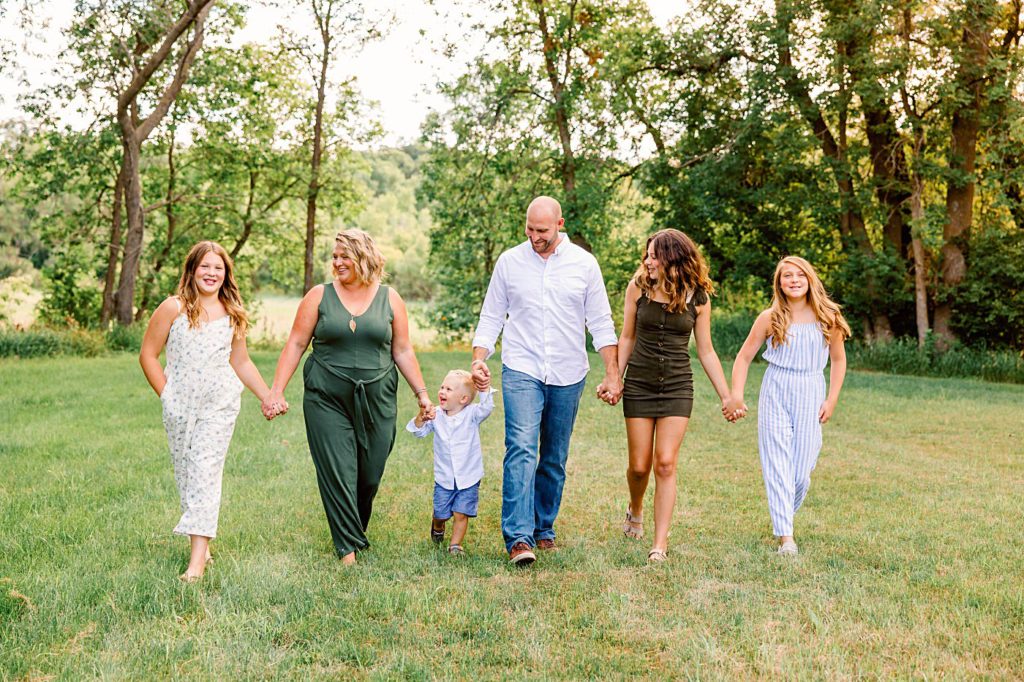 Family walking and smiling towards the camera | Amber Langerud Photography