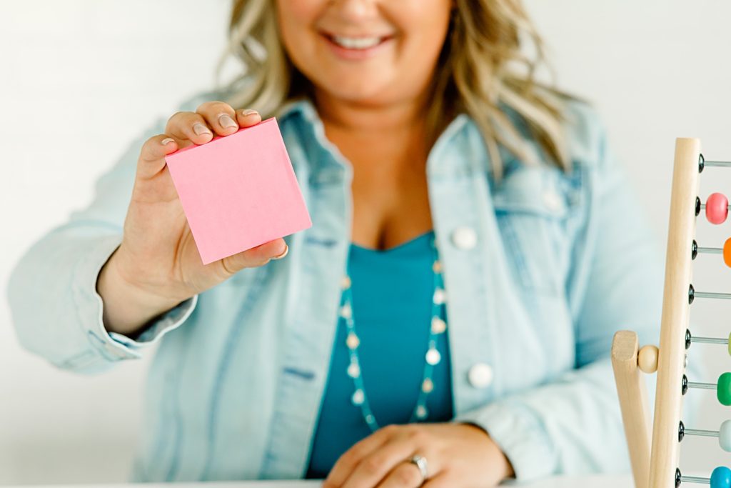 teacher influencer holding a stack of sticky notes brand photogrpahy