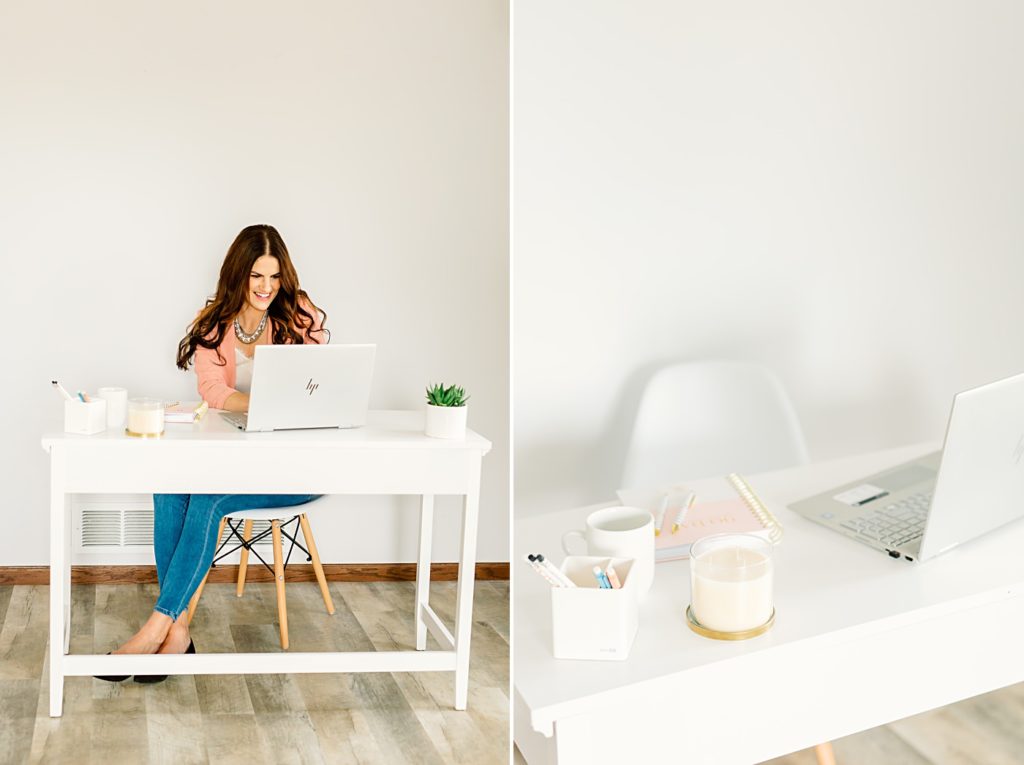 Business Owner sitting at white desk working on her business | Amber Langerud Photography
