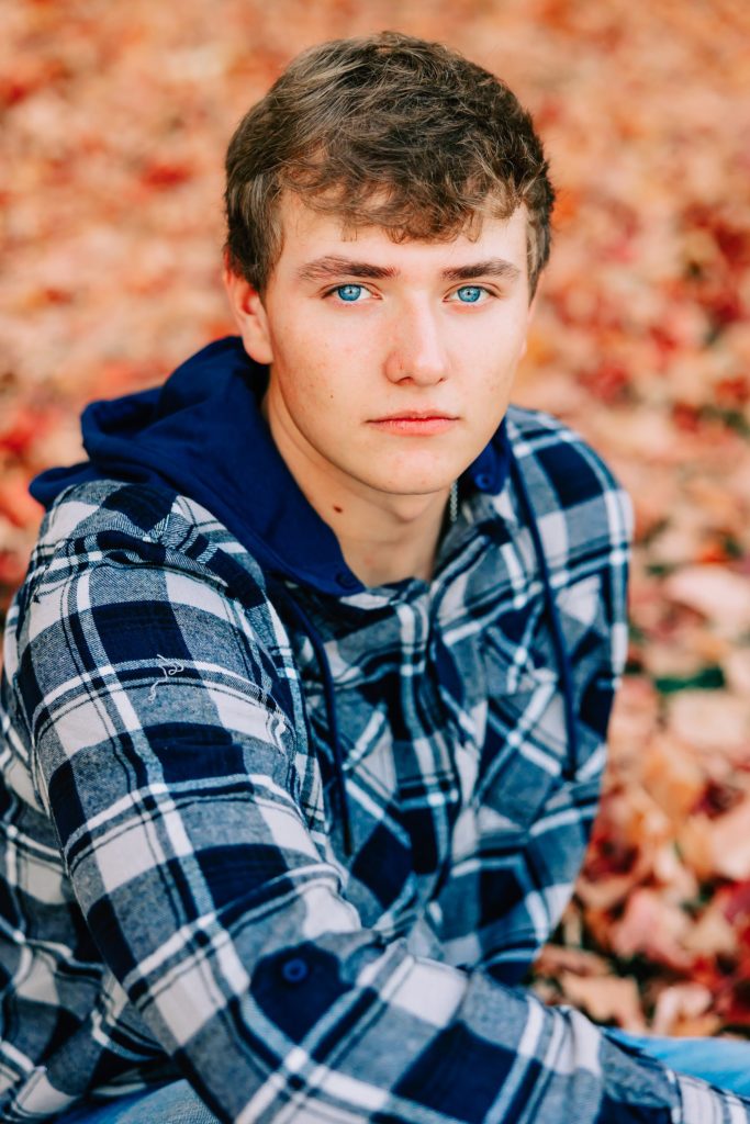 Senior guy wearing blue with blue eyes, what to wear guide, complimenting eye color.