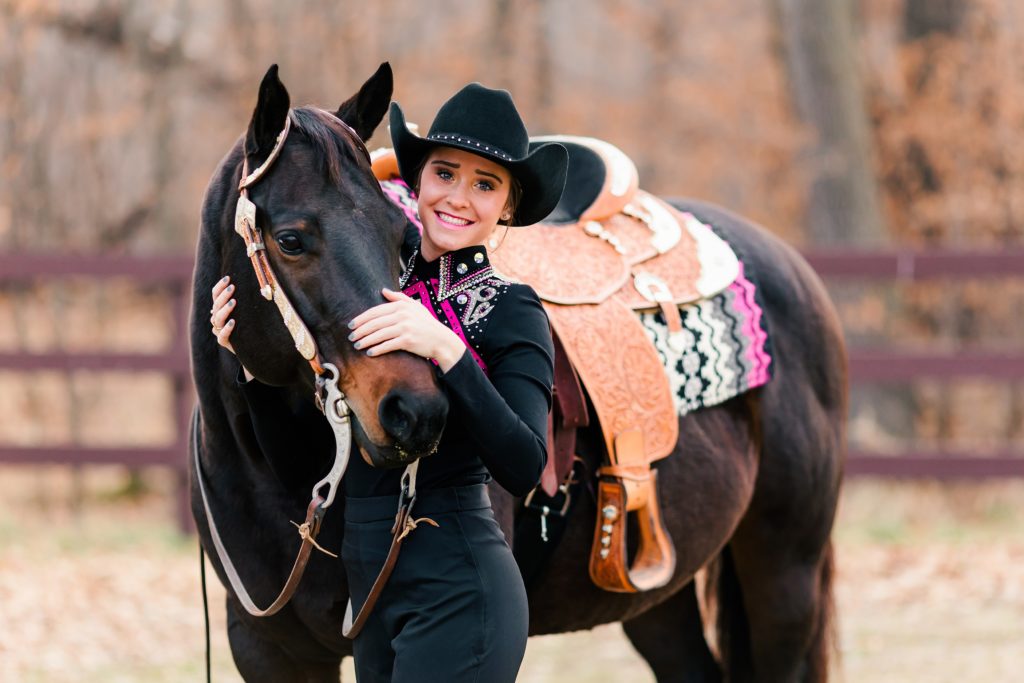 A girl and her horse in pink accented western attire