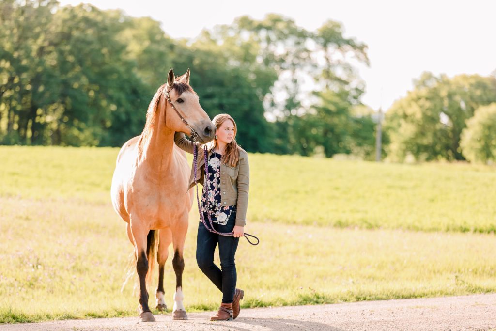 Senior Pictures with Your Horse, girl wearing green jacket and buckskin horse