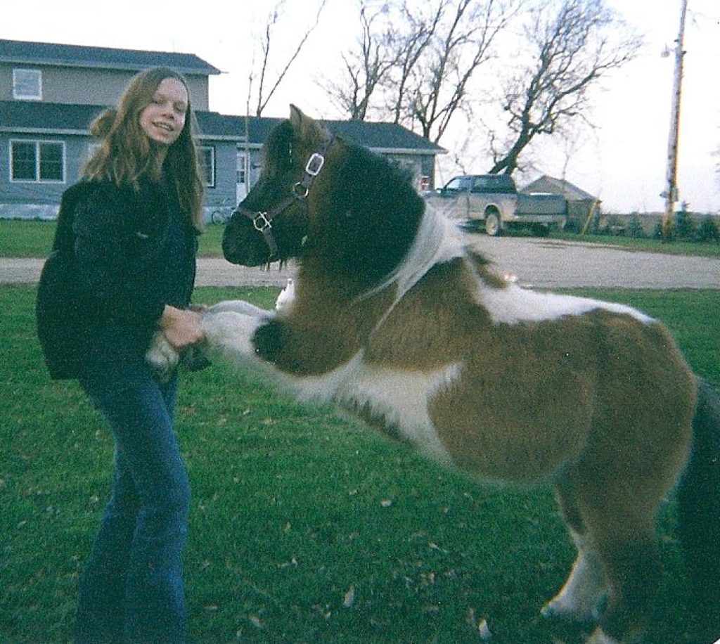 Film photo of girl with miniature horse