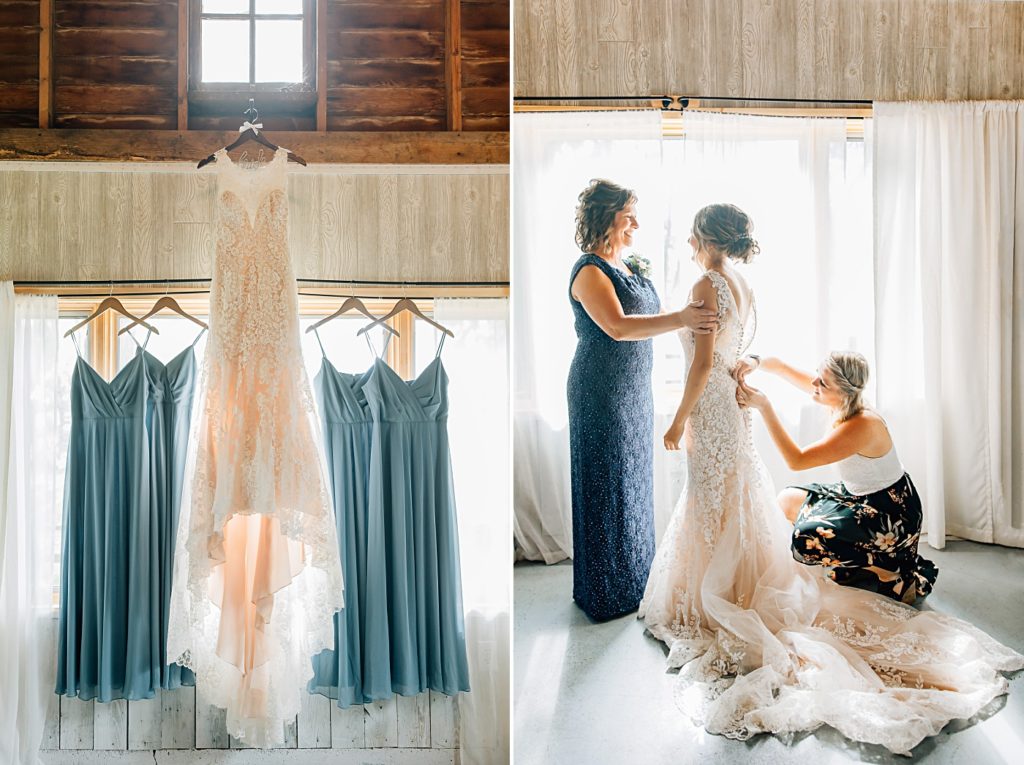 Bride putting on dress in barn at dunvilla bridal suite