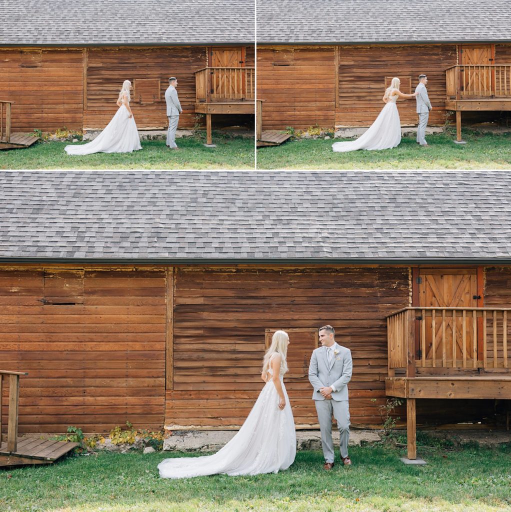 Bride & Groom first look photos in front of a rustic building at the Hitching Post Wedding Venue