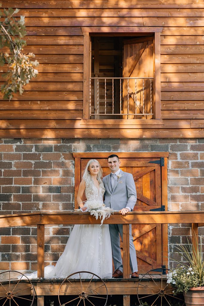 Bride and groom in front of the Hitching Post Wedding Venue