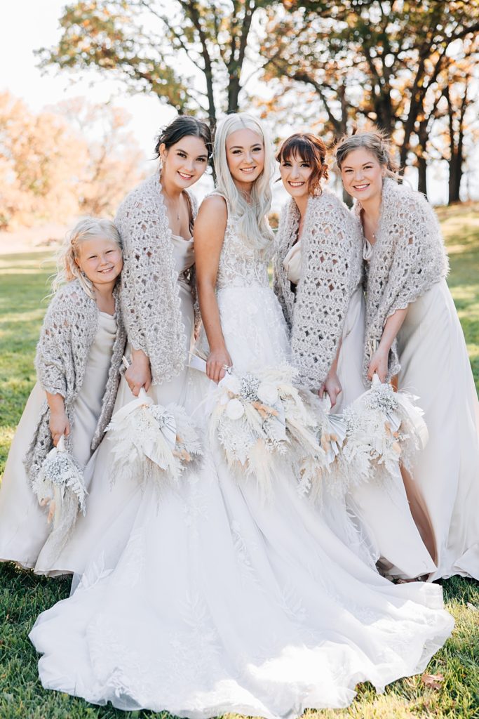 Fall bridesmaids wearing knitted shawls at the Hitching Post MN