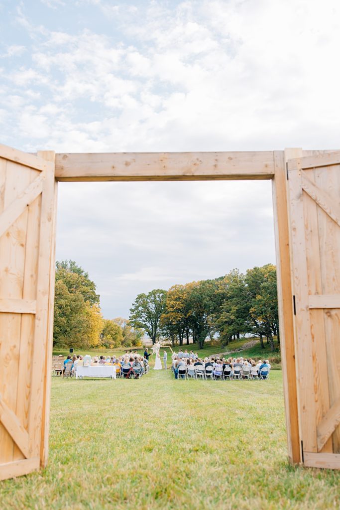 Sneak into ceremony site through barndoors at the Hitching Post