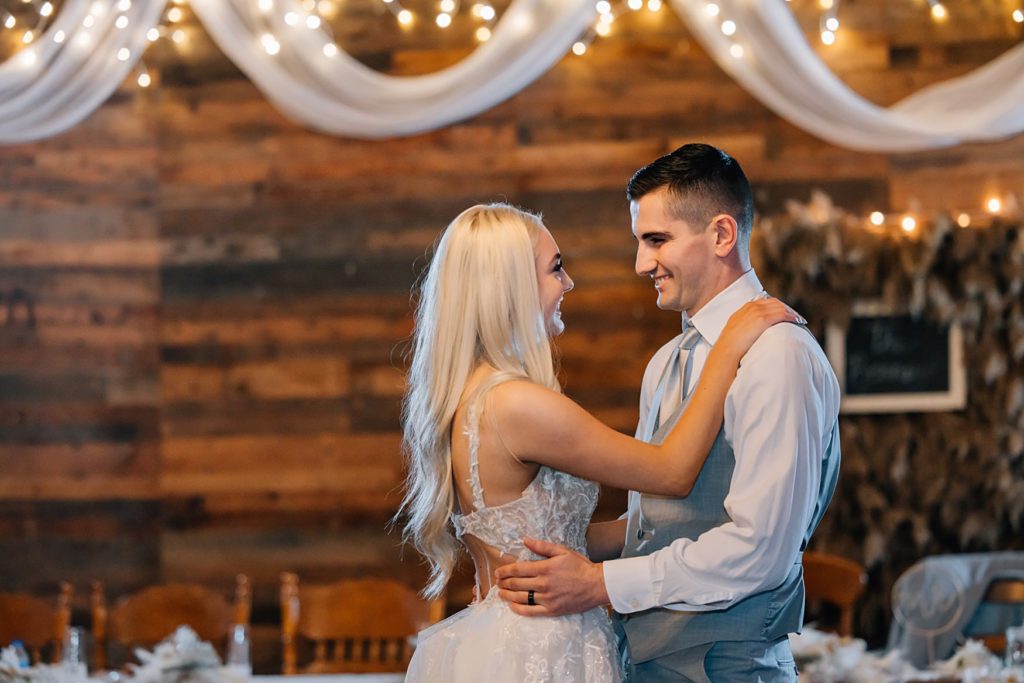 bride and groom dancing in the hitching post mn barn