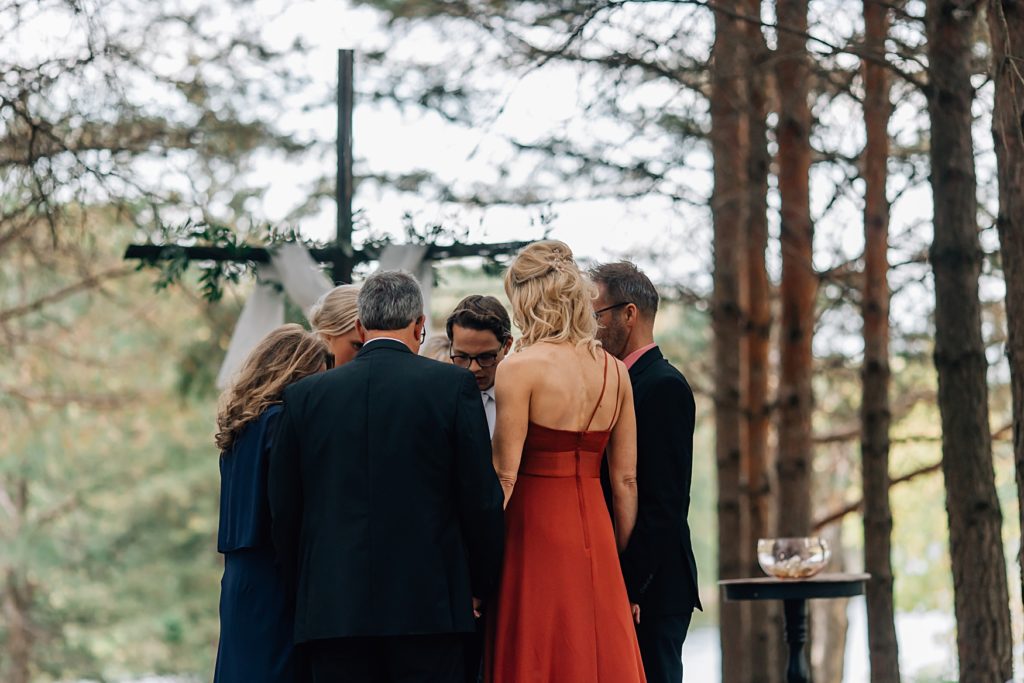 family prayer during Cody & Elly's wedding