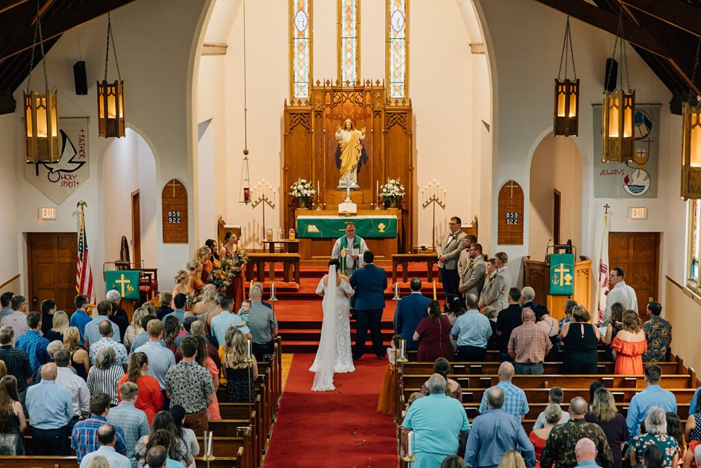 wide shot of ceremony in church 