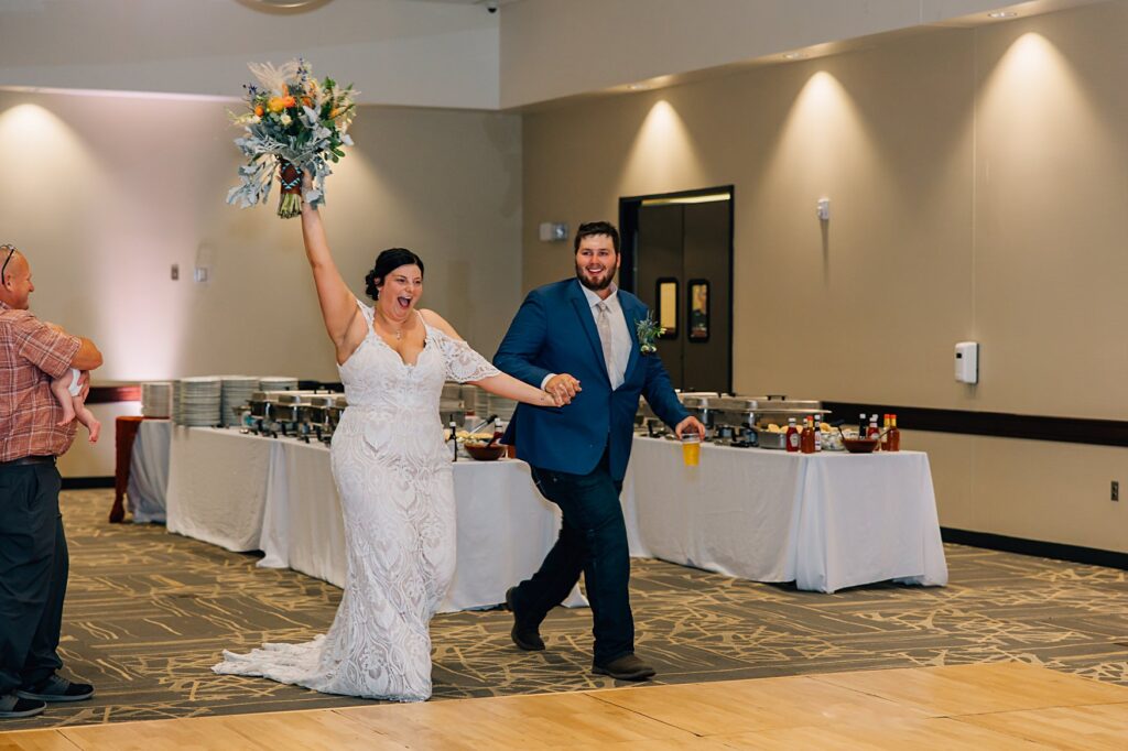 bride and groom entering reception in Worthington, MN