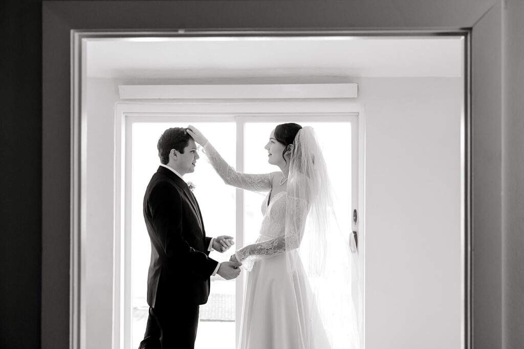 Bride and Groom looking at each other at the Lafayette Club in Minnetonka Beach, MN