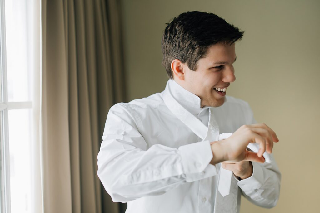 Groom getting ready at the Lafayette Club in Minnetonka Beach, MN