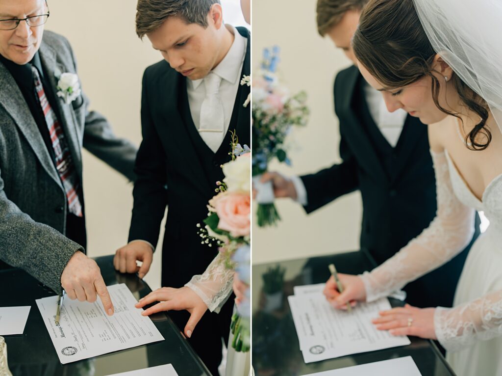 Bride and groom signing marriage license at the Lafayette Club in Minnetonka Beach, MN