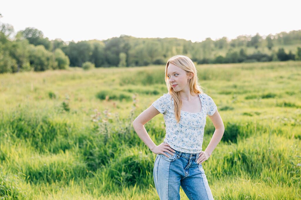 Minnesota high school senior photo in a green field