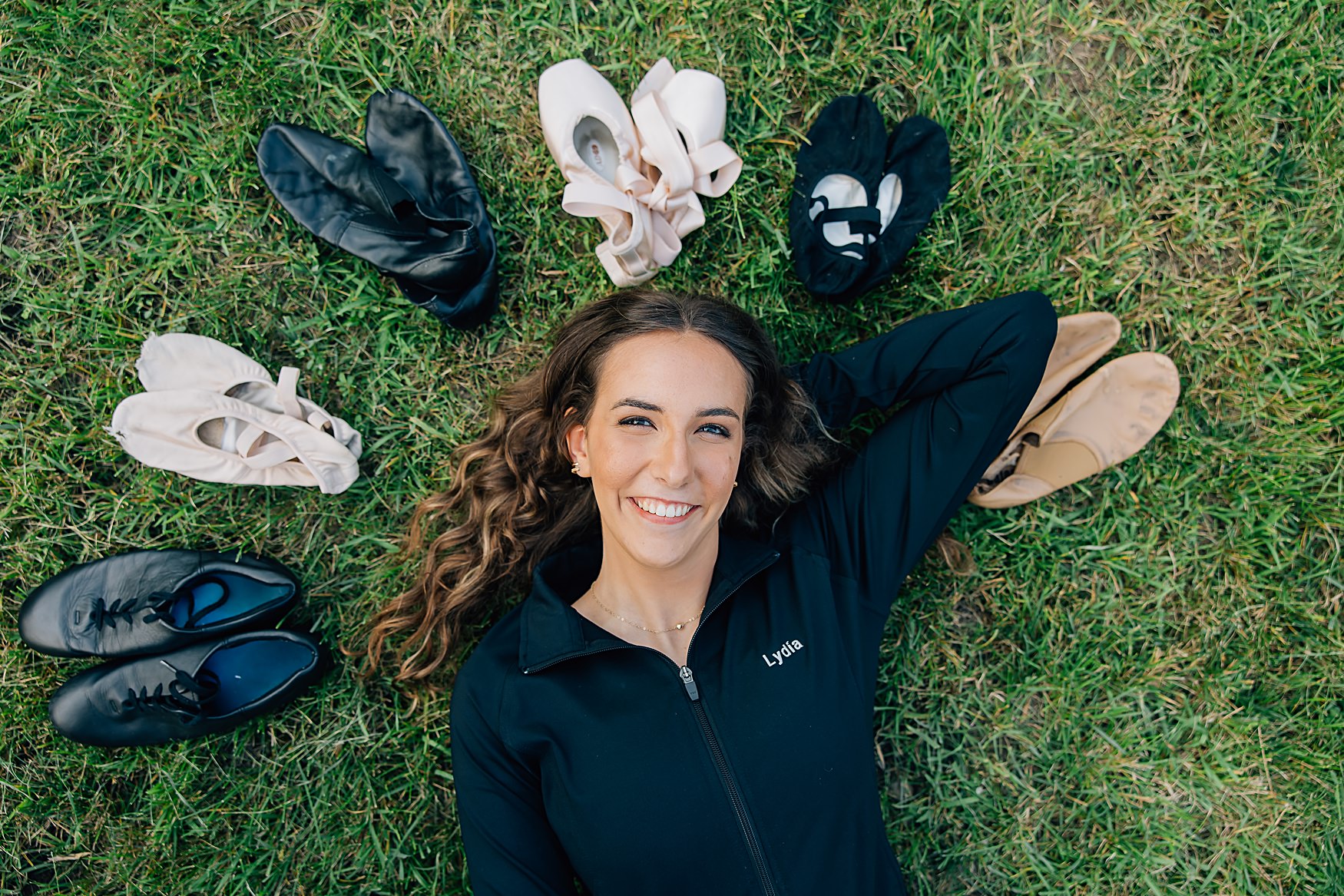 high school senior photo with ballet slippers