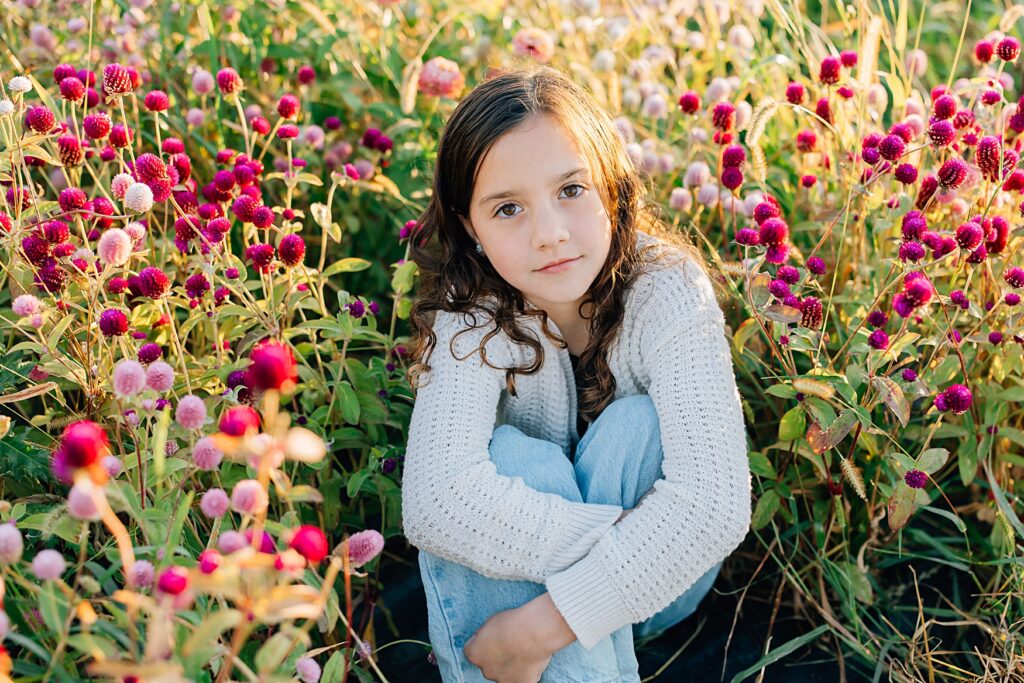 client sitting in the photo-flower field