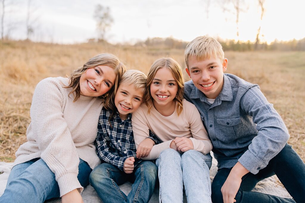 Family Photo of Kids Smiling at the Camera during Golden Hour in Minnesota