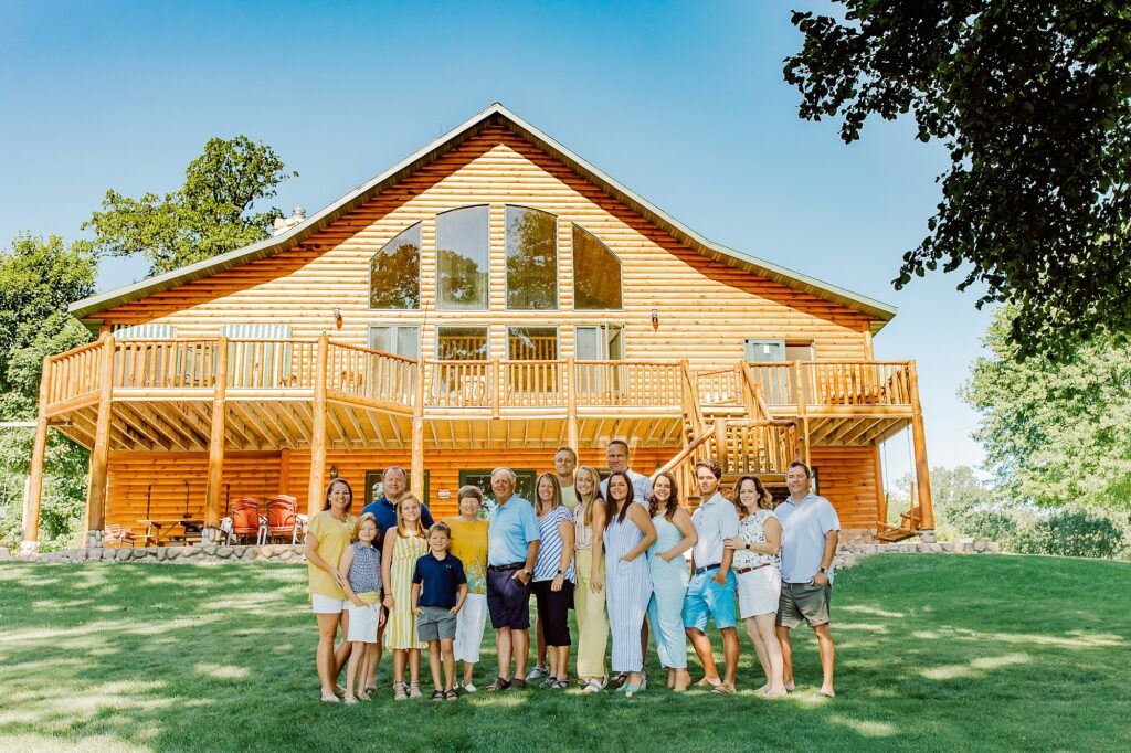 Extended family gathered outside their lake cabin.