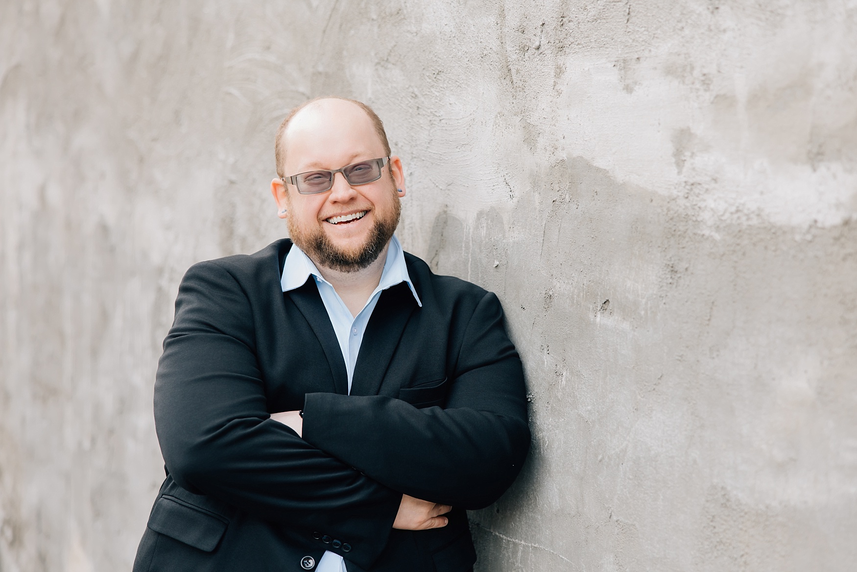 Downtown Detroit Lakes Lunch Break Headshot | guy leaning against wall